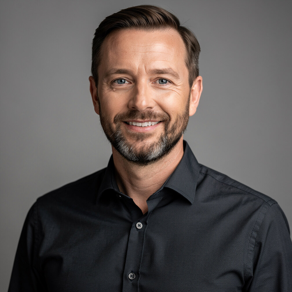 Studio portrait of a senior male television director with a beard